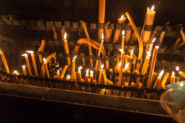 lighted candles at the Marian shrine in Fatima, Portugal - Photo, Image