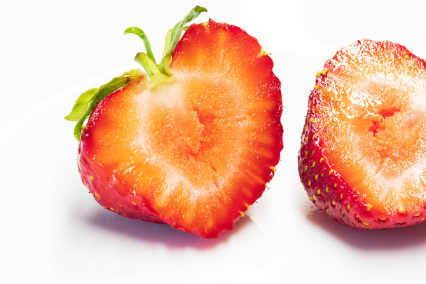 strawberry close-up / on a white plate background - Φωτογραφία, εικόνα