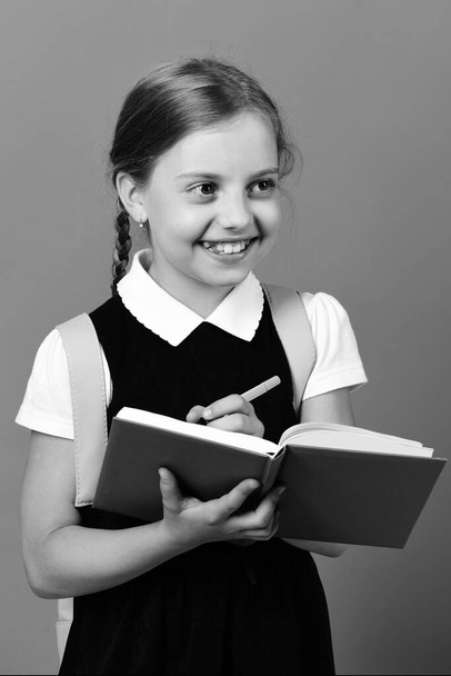 Back to school and education concept. School girl with smile - Foto, imagen