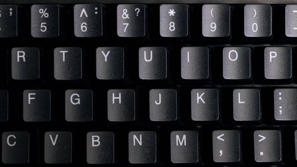 Zwarte computer toetsenbord toetsen close-up, achtergrond voor tekst - Foto, afbeelding