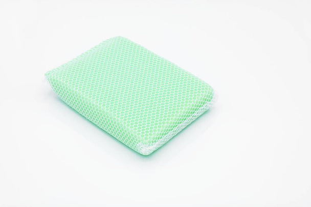 pale blue sponge in net for cleaning ware - Fotoğraf, Görsel