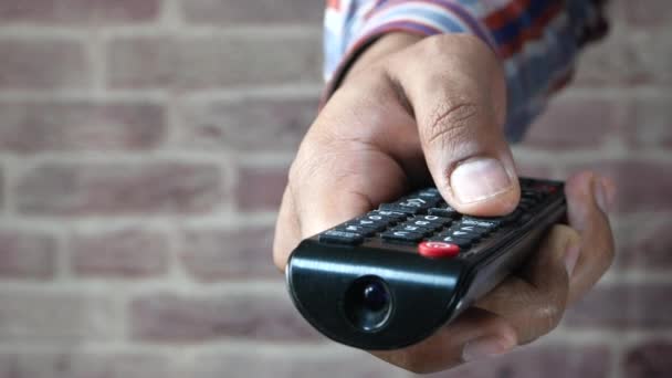 close up of man hand holding tv remote. - Footage, Video