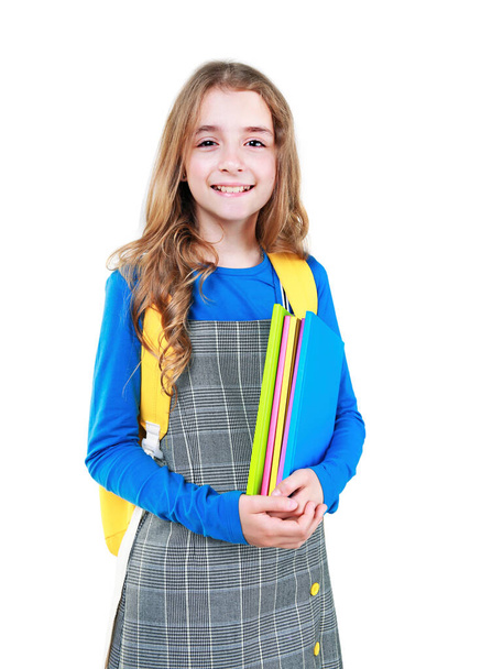 Caucasian child girl with books and backpack isolated.Pupil,smiling schoolgirl teenager.Schoolkid colorful portrait. - Fotoğraf, Görsel