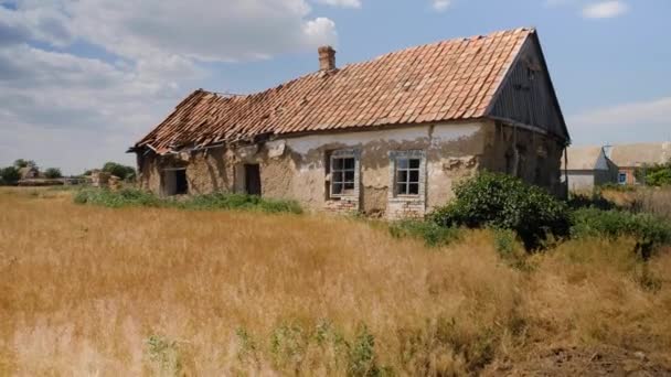 Old dilapidated rural house with a red-tiled roof - Footage, Video