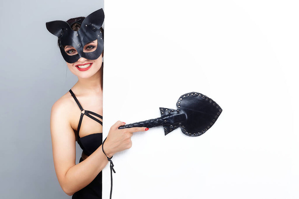 beautiful girl in a cat mask. indicates the free space for the text. white background. - Photo, image