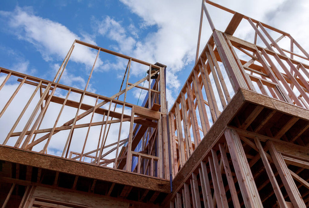 Residential construction home framing under construction wooden truss, post beam framework frame house - Photo, Image