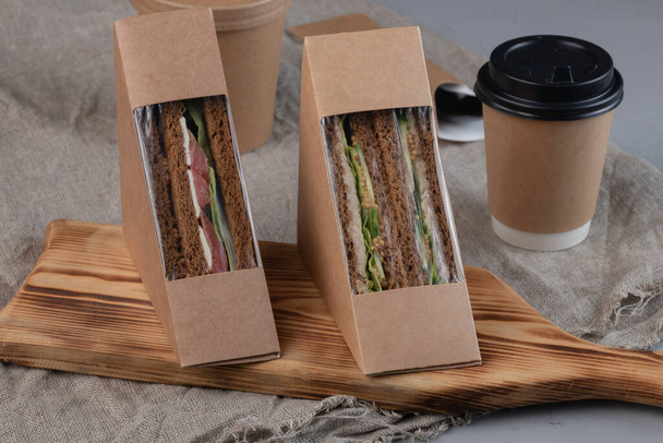 Eco-friendly coffee and sandwiches with fresh vegetables, tuna, salmon and herring paste. Vegan food. - Photo, Image