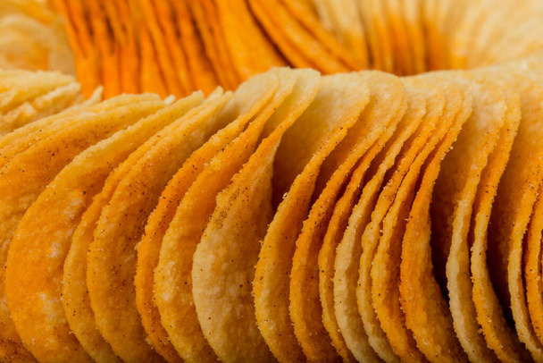 tasty potato chips on white background, close-up view - 写真・画像