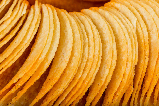 tasty potato chips on white background, close-up view - 写真・画像