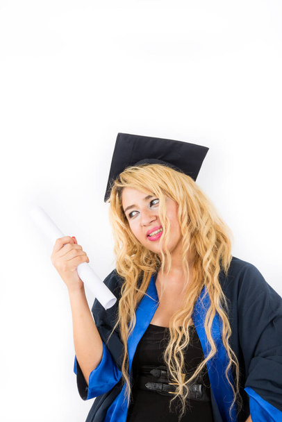 young girl in graduation hat holding diploma on white background - 写真・画像