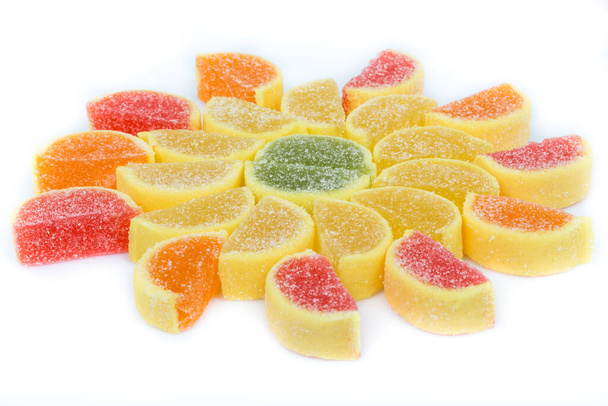 fruit flavored jelly candies slices on white background - Foto, Bild