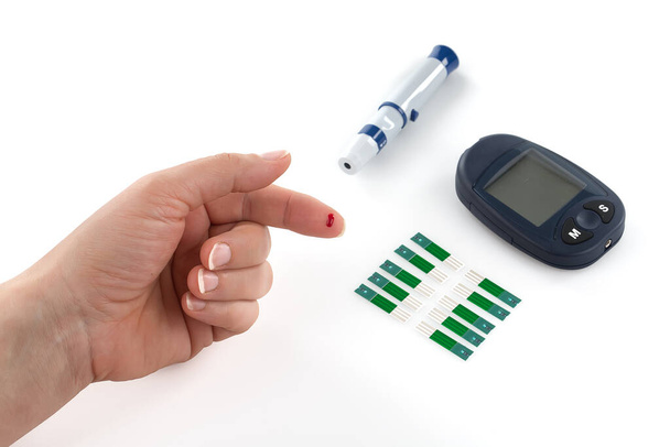 Glucometer and syringe for insulin, monitoring of diabetes mellitus isolated on white background. - Photo, Image