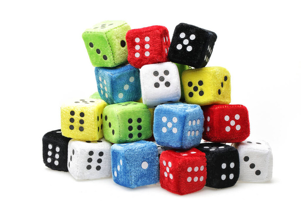 Colorful game dice with yellow, green, blue and purple dice. multi-color dice on white floor. - Photo, Image