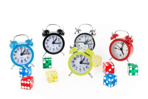 alarm clock with red and green, colored, yellow, blue, white background - Foto, Imagen