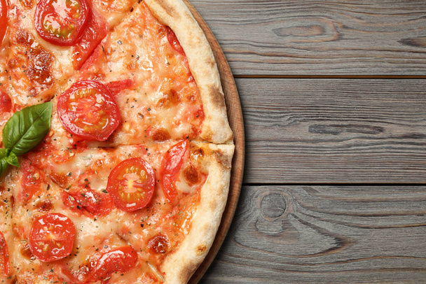 Delicious pizza Margherita on wooden table, top view. Space for text - Φωτογραφία, εικόνα