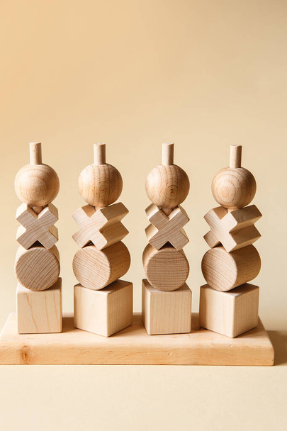 Children's wooden toys. Sequencing Blocks learning resource for educating shapes, fine motor skills, hand eye coordination, mathematical skills. Natural wood construction set. Educational equipment - Photo, Image