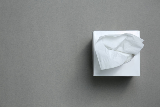 Box of paper tissues on grey background, top view. Space for text - Foto, Imagem