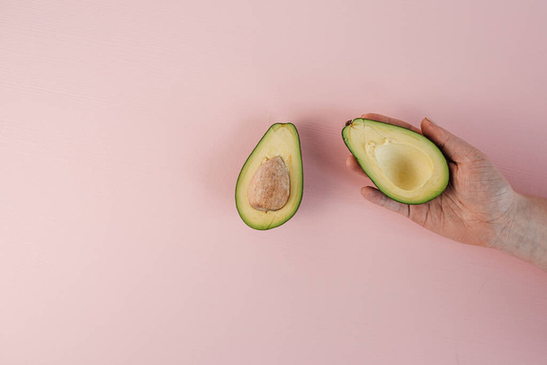 Flat Lay of Avocado Pear Lying on the Pink Background Table - Photo, Image
