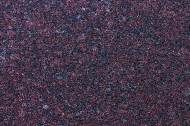 Dark purple granite background used for kitchen worktop, table, window sill, fence. Red violet igneous rock stones texture. Text sign advertising design mockup. Architecture detail natural backdrop. - Foto, afbeelding