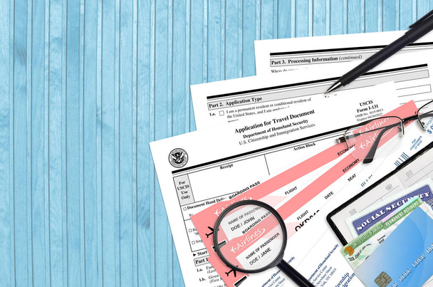 USCIS form I-131 Application for travel document lies on flat lay office table and ready to fill. U.S. Citizenship and Immigration services paperwork concept. Top view - Photo, Image