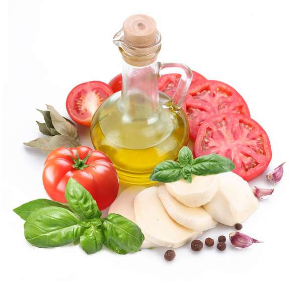 Ingredients for making salad with mozzarella and tomatoes on a w - Foto, imagen