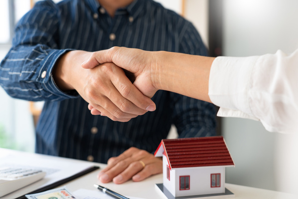 House developers and customer shaking hand after accept agreement finish buying or rental real estate for transfer right of property - Photo, Image