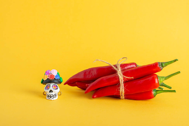 Red hot chili pepper and Catrina La Calavera Garbancera , Dapper Skeleton, Elegant Skull - 写真・画像