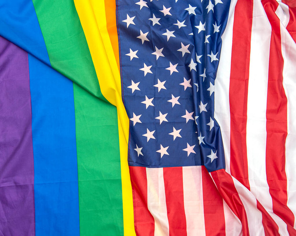 Fabric USA and gay pride rainbow flags as background, concept picture - Foto, Imagem