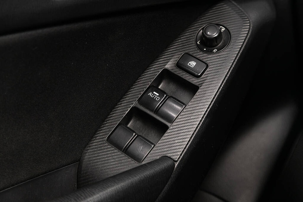 Novosibirsk/ Russia  June  03 2020: Mazda 3, Interior of modern car. Side door buttons: window, mirror adjustment buttons, door lock. Car inside  - Фото, изображение