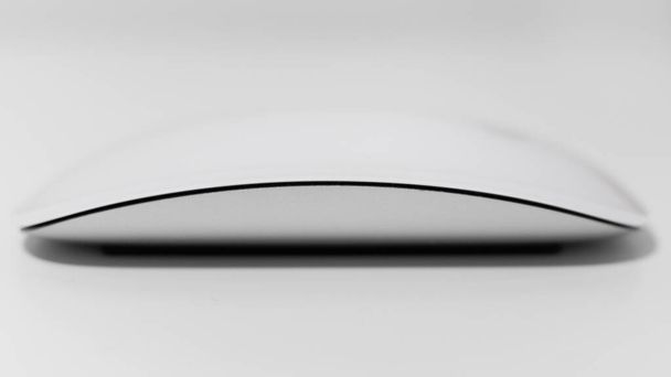 Apple magic mouse. White multi-touch mouse shallow depth of field on white background. - Photo, Image