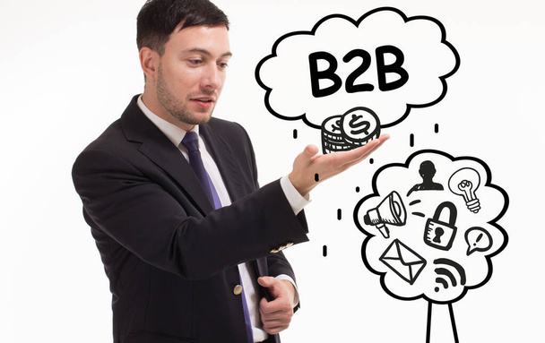 Business, technology, internet and network concept. Young businessman thinks over the steps for successful growth: B2B - Фото, изображение