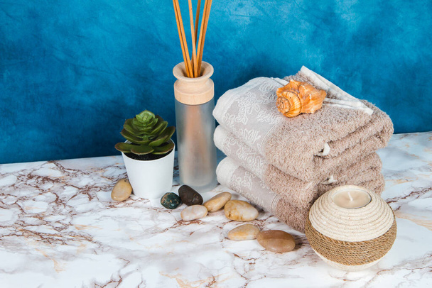 Spa objects and elements on a marble table and blue background - Photo, Image