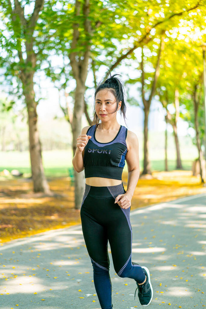 Asian woman jogging and running at park - 写真・画像