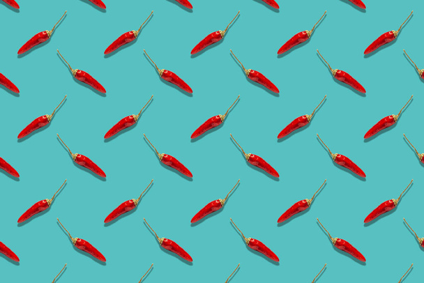Chili pepper on a bright background pattern - 写真・画像