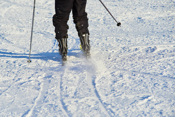 skiing downhill person, winter season, snow covered land  - Foto, imagen