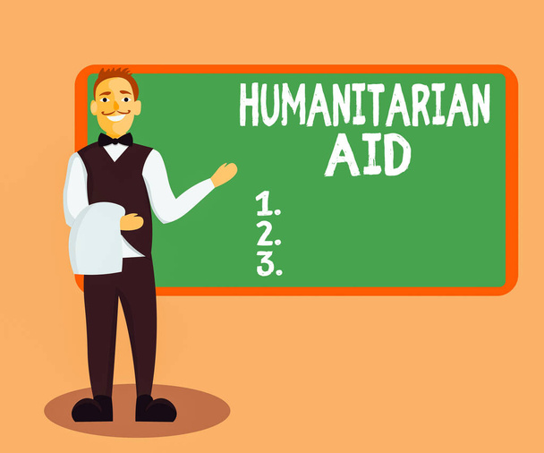 Handwriting text Humanitarian Aid. Concept meaning immediate assistance provided after natural and manmade disaster Male Waiter Smiling Standing in Uniform Hand Presenting Blank Menu Board. - Photo, Image