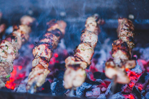Marinated shashlik preparing on a barbecue grill over charcoal. Shashlik or Shish kebab popular in Eastern Europe. Shashlyk Roast Beef Kebabs On BBQ Grill. kebab - Photo, Image