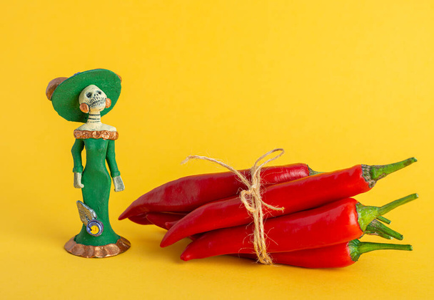 Red hot chili peppers and Catrina La Calavera Garbancera , Dapper Skeleton, Elegant Skull - 写真・画像