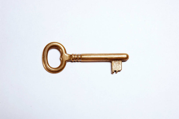Golden Key against white backgroun - Photo, Image