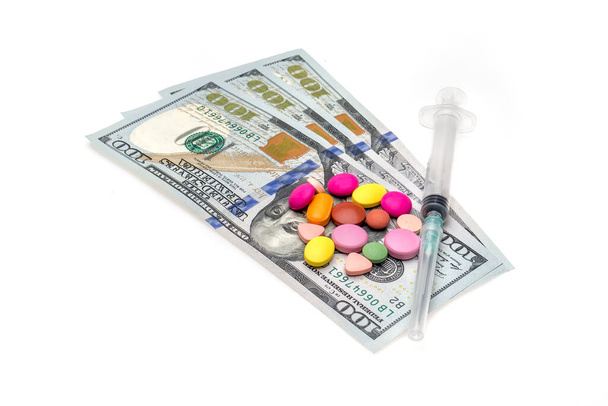 Money, pills and syrgine on white background - Foto, Bild
