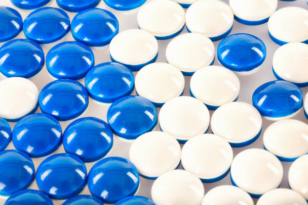 blue pills on a white background - Foto, imagen