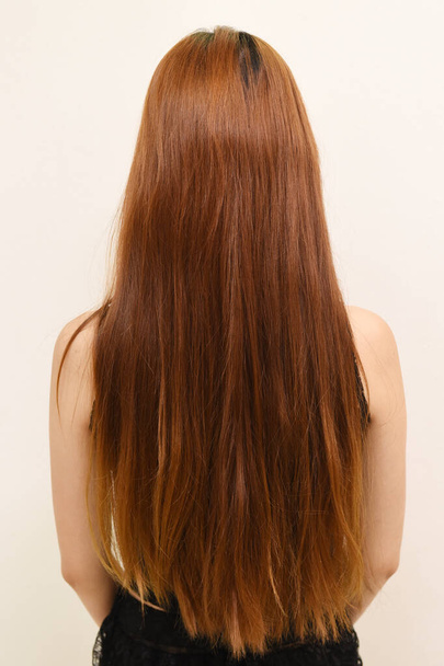Portrait of a woman with a beautiful long hair - Фото, зображення