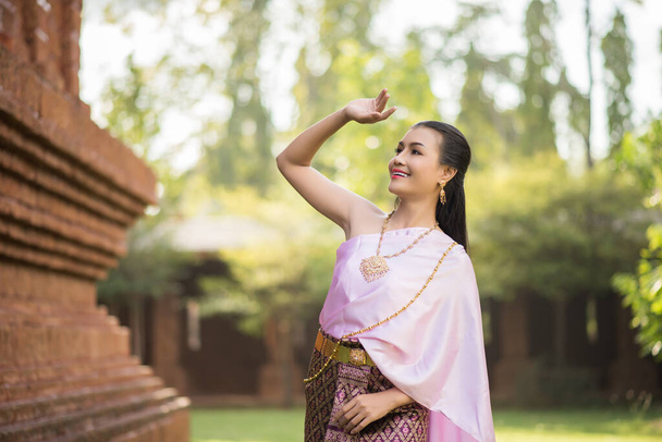 Beautiful Woman wearing typical Thai dress - Photo, image