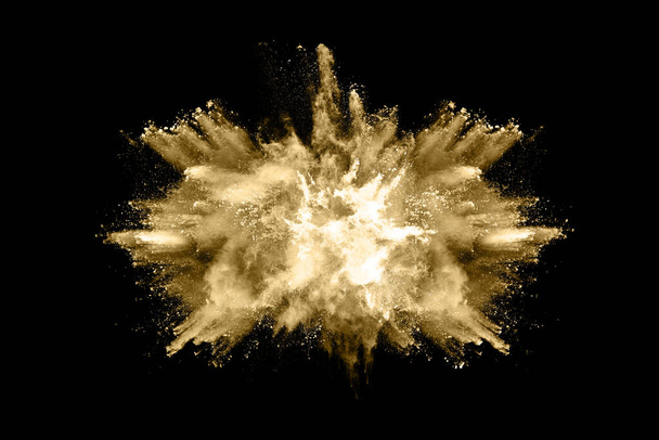 Gouden poeder explosie op zwarte achtergrond. Beweeg niet.. - Foto, afbeelding
