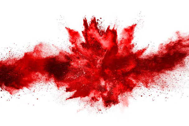 Bevriezen beweging van rood poeder exploderen, geïsoleerd op witte achtergrond. Abstract ontwerp van rode stofwolk. Deeltjes explosie screensaver, behang - Foto, afbeelding