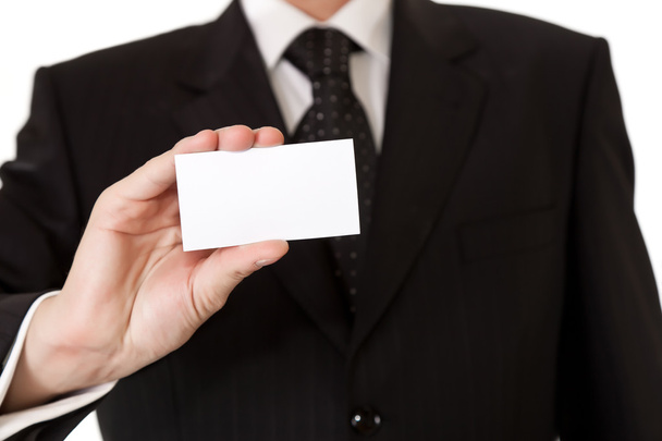Homem de negócios segurando cartão em branco no fundo isolado branco
 - Foto, Imagem
