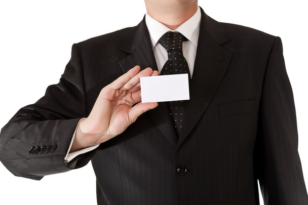 Liikemies, jolla on tyhjä kortti valkoisella taustalla
 - Valokuva, kuva