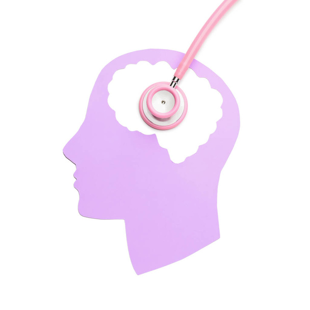 Ludzka głowa i stetoskop na białym tle. Pojęcie demencji - Zdjęcie, obraz