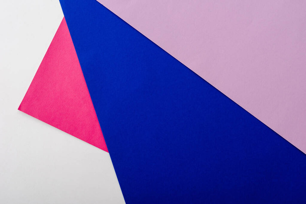 abstract geometric background with white, pink, blue and violet paper - Фото, зображення