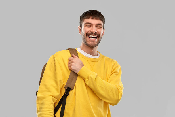 happy smiling young man with backpack - Fotografie, Obrázek